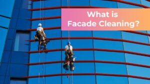 The question What is Facade Cleaning? and two men facade cleaning a building