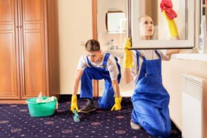 2 people doing a deep cleaning throughout the house.